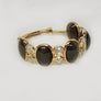 Black Spinel Ring with Diamonds in 18 Karat Yellow Gold